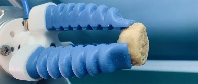 picking cookies from a baking tray using a cobot