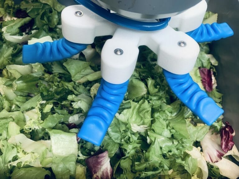 robot gripper spread to pick up salad