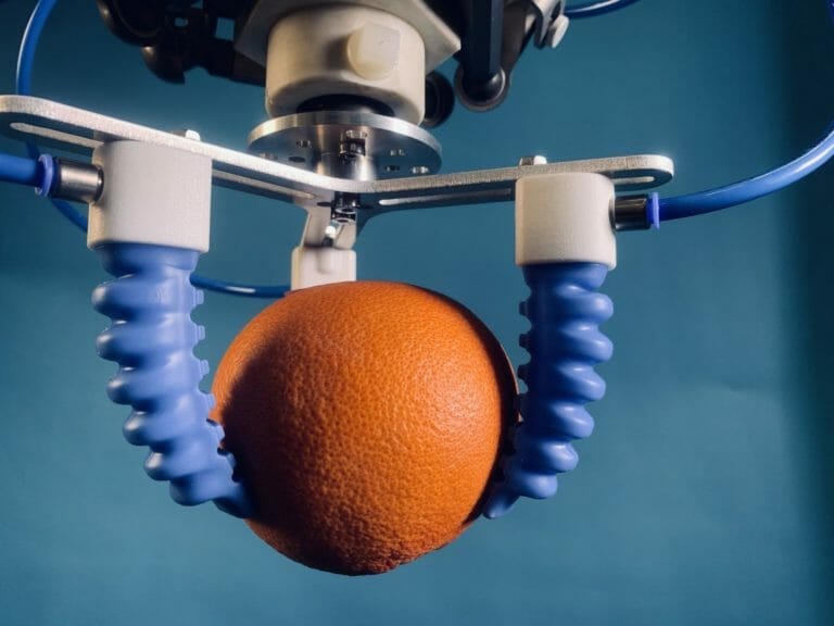 Soft actuator jaws holding an orange